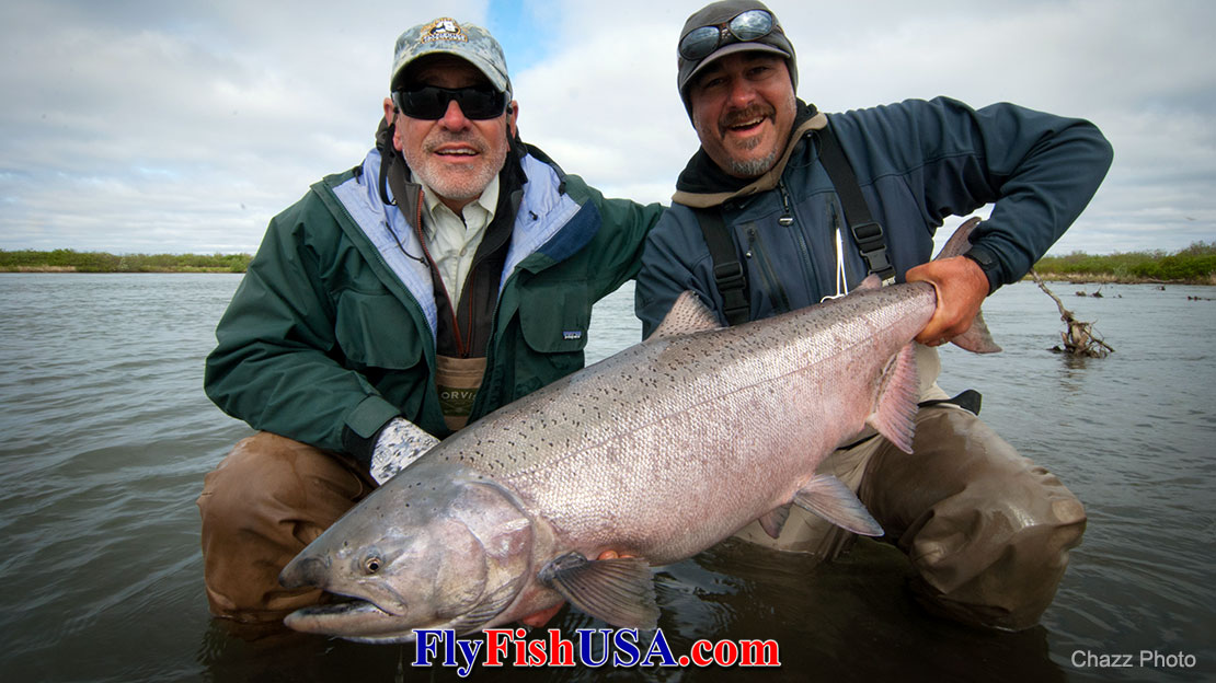 Picture of Charles St. Pierre with a huge Alaska King Salmon caught with a Foxxee Dog fly.