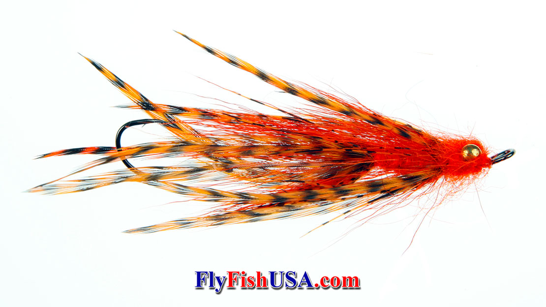Picture of an Orange Pick Yer' Pocket fly tied by Solitude Fly Company.