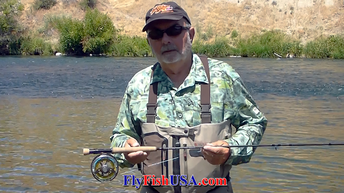 Mark Bachmann holding a Shadow II rod and reel loaded with an Ambush Line.